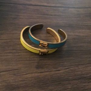 2 bracelets with letter R yellow and blue